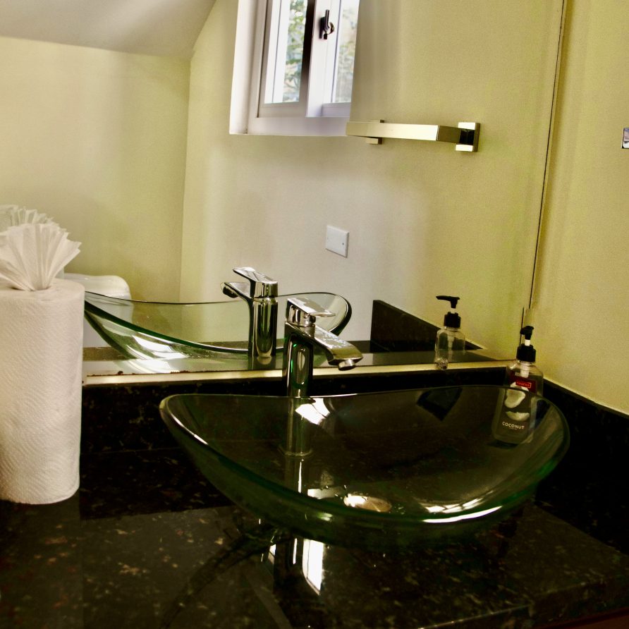 4BR Villa bathroom vanity with vessel sink under sloped ceiling