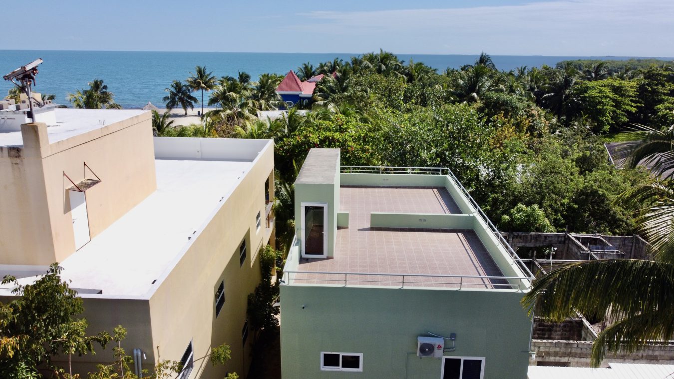Placencia Cave Tubing Accommodation: Day Trip Base for Caves Branch 1 Placencia, Belize — aerial / beach view used in September travel guide