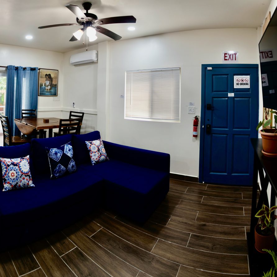 2BR Villa K+Q living and dining area with blue sectional