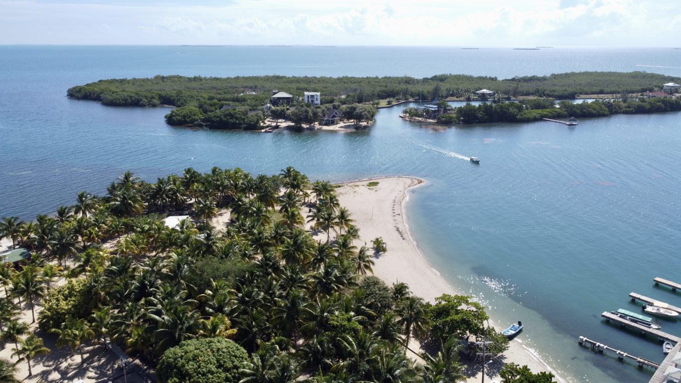 Placencia in July: Weather, Rates, and What to Do 1 Placencia, Belize — aerial / beach view used in July travel guide