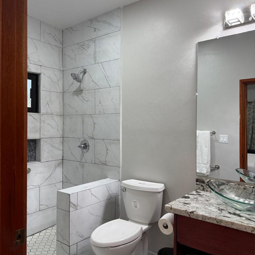 Toucan Room marble shower with vanity