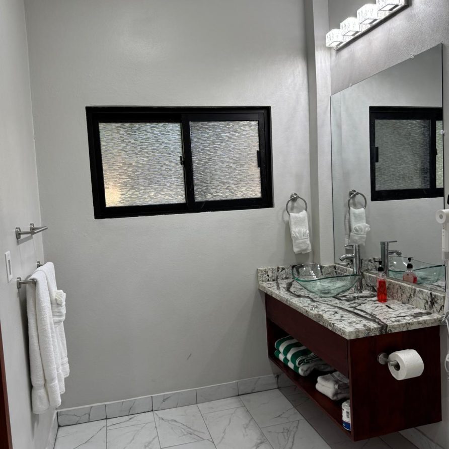 MeMe's Place Estate marble bathroom with vessel sink vanity